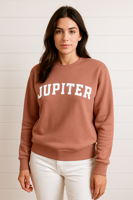 Woman wearing a brown sweatshirt with 'JUPITER' printed on it against a white background